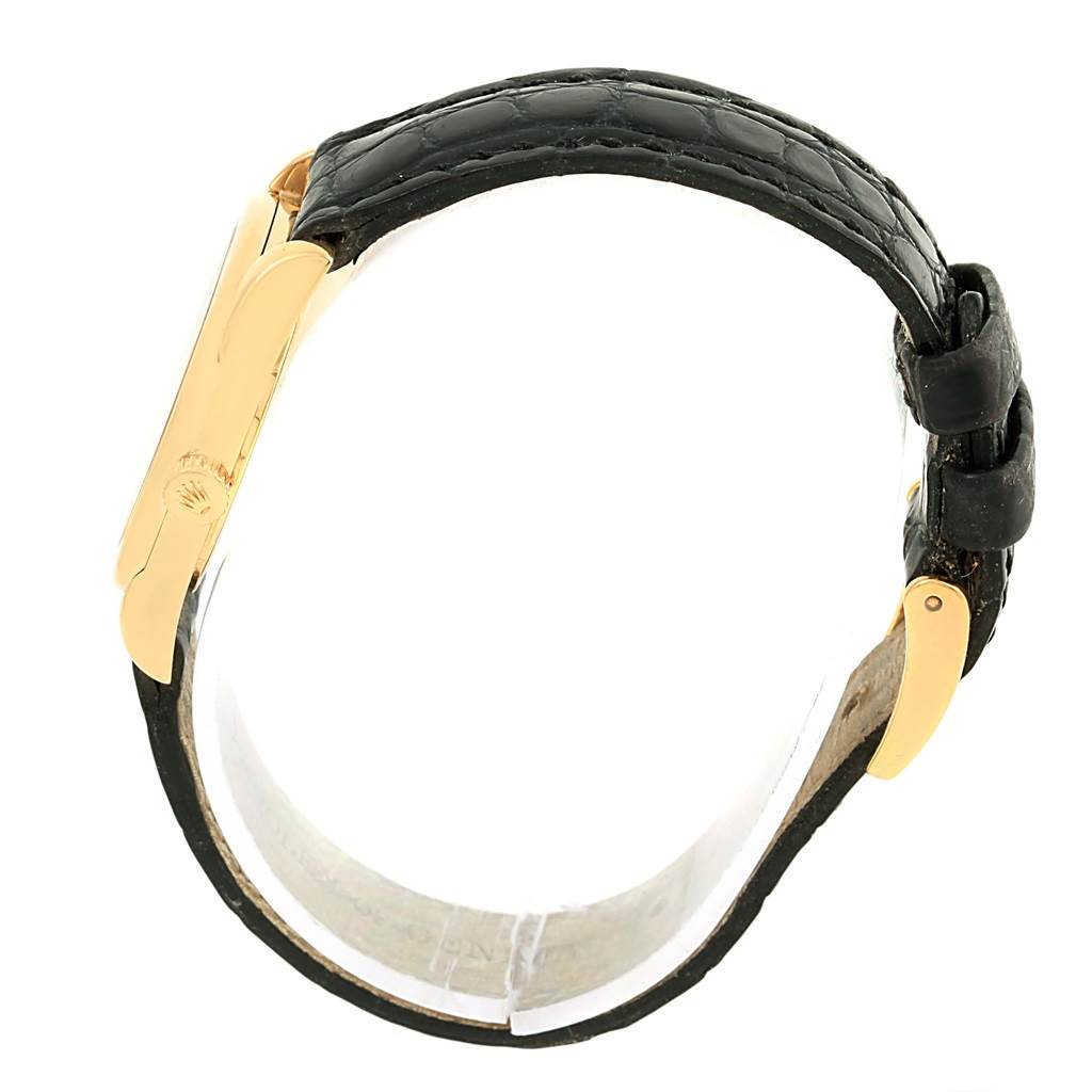 This image shows the side view of a Rolex Cellini 6229 Women's Yellow Gold Black Dial 6229 Women's Yellow Gold Black Dial watch, highlighting its black leather strap and gold clasp.