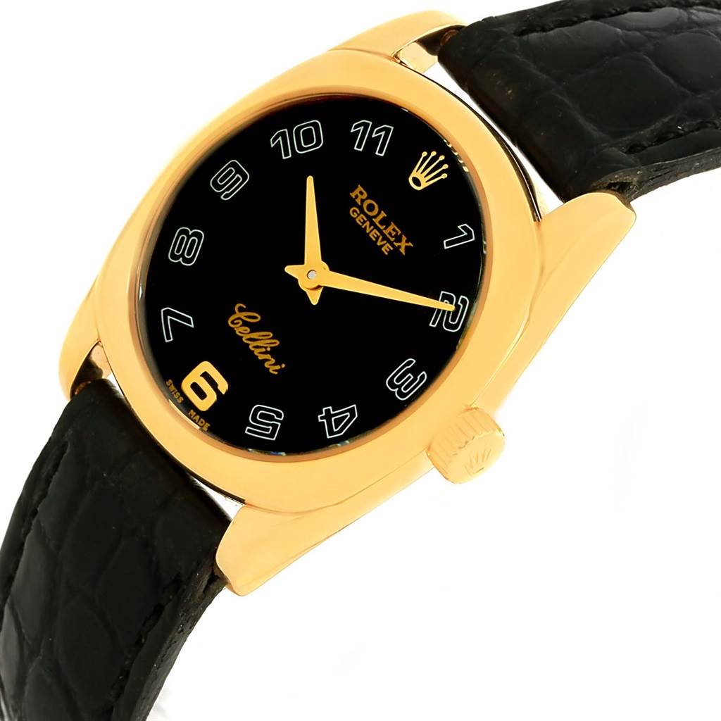 The Rolex Cellini 6229 Women's Yellow Gold Black Dial 6229 Women's Yellow Gold Black Dial watch is shown at a slight angle, highlighting the black dial, gold casing, and black leather strap.