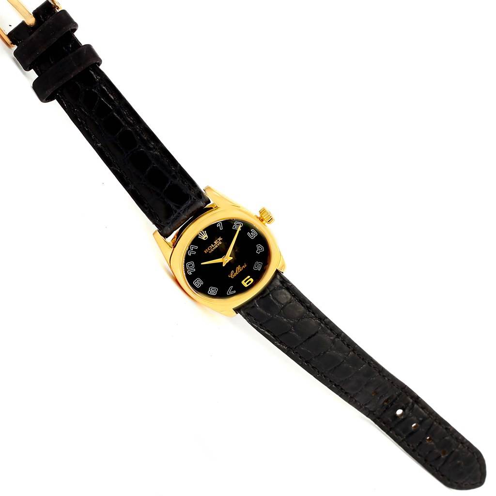 The image shows a Rolex Cellini 6229 Women's Yellow Gold Black Dial 6229 Women's Yellow Gold Black Dial watch from a top-down angle displaying the face, crown, and both bands.