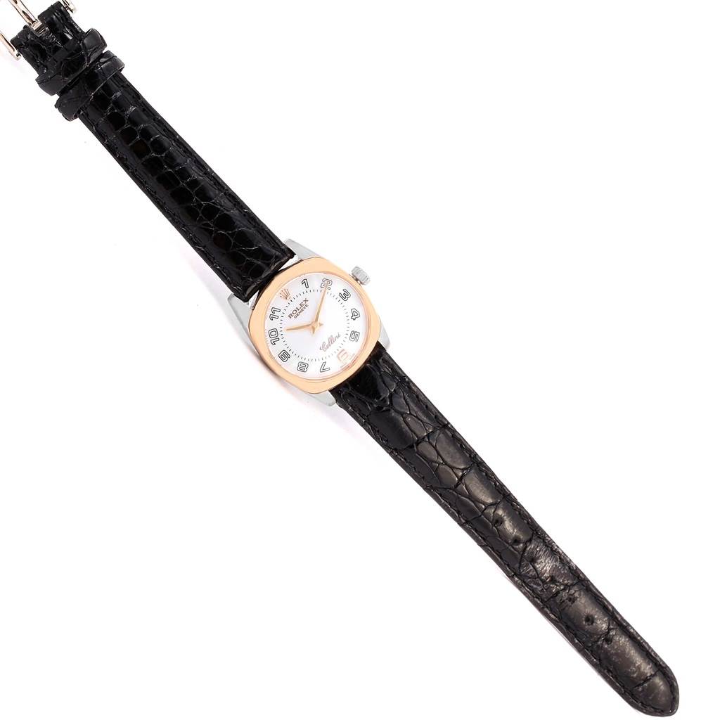 The image shows a top view of a Rolex Cellini 6229 Women's White Gold White Dial 6229 Women's White Gold White Dial watch with a black leather strap and a white dial.
