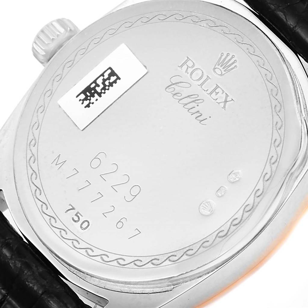 The image shows the back case of the Rolex Cellini 6229 Women's White Gold White Dial 6229 Women's White Gold White Dial model with its engravings and leather strap.
