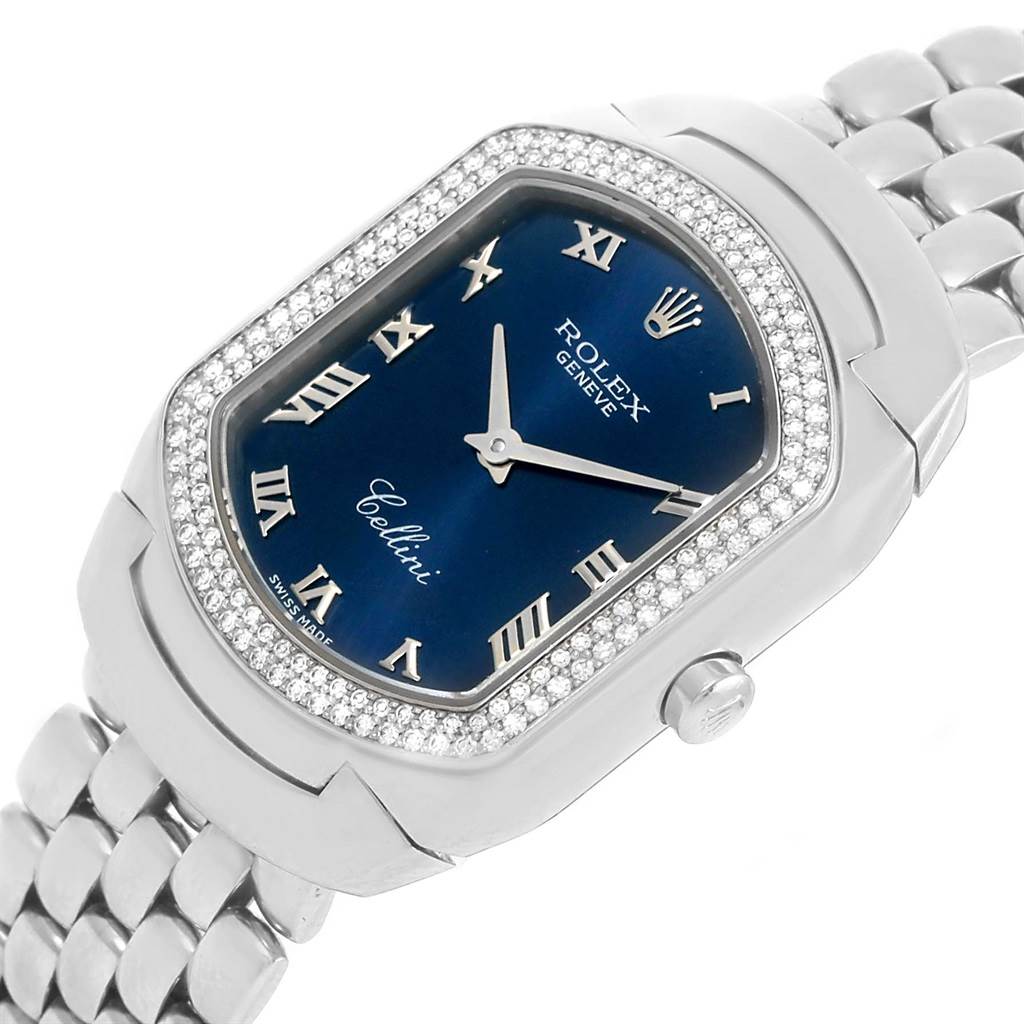 The image shows a close-up view of a Rolex Cellini 6691 Women
s White Gold Blue Dial 6691 Women
s White Gold Blue Dial watch, featuring its face, bezel, and part of the bracelet.