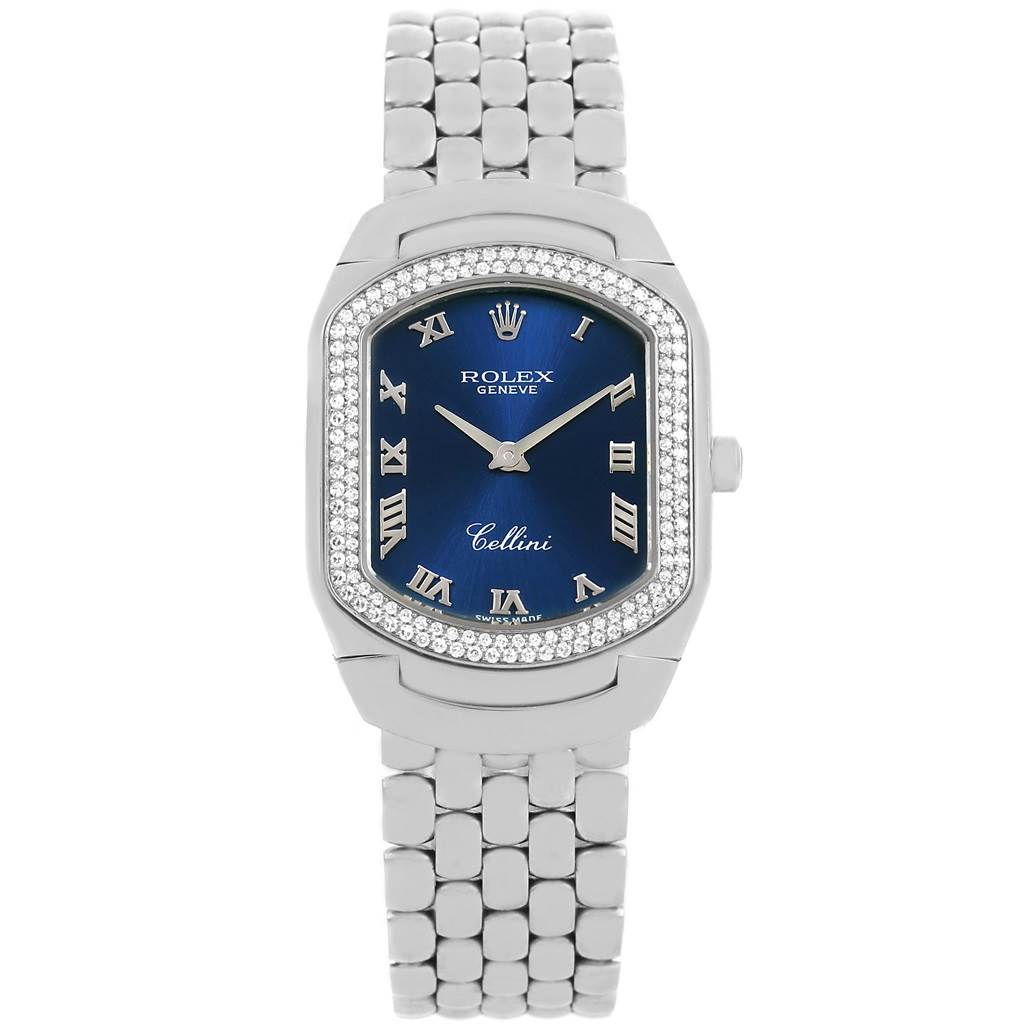 The image shows a front view of a Rolex Cellini 6691 Women
s White Gold Blue Dial 6691 Women
s White Gold Blue Dial watch with a blue dial, Roman numerals, and a metal link bracelet.