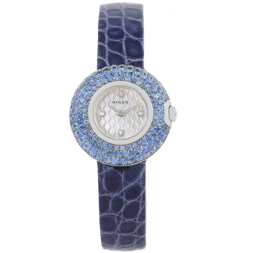 This image shows a Rolex Cellini 6201 Women's White Gold Mother of Pearl Dial 6201 Women's White Gold Mother of Pearl Dial watch from a frontal angle, highlighting its blue leather strap, gemstone-studded bezel, and face.