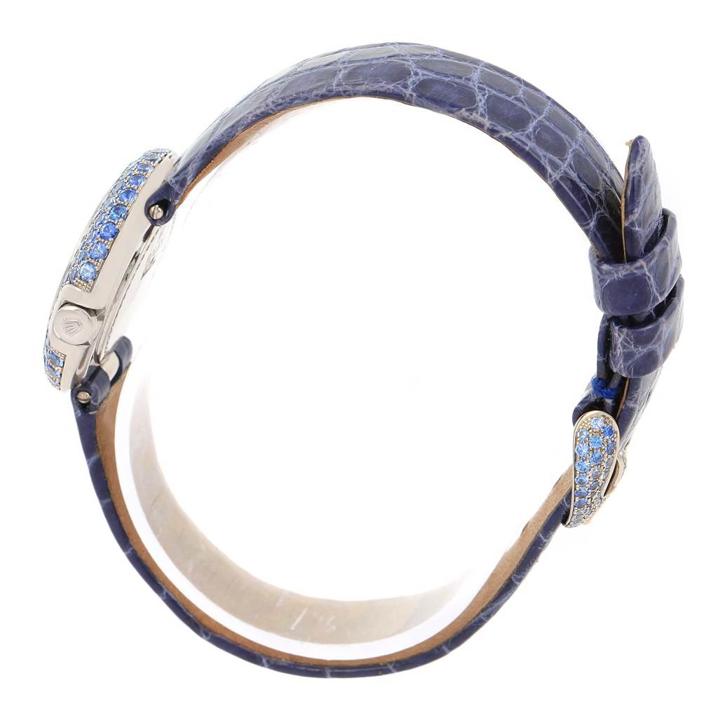 This image shows the side view of the case and the buckle of the Cellini model by Rolex, highlighting the strap and gem-encrusted details.