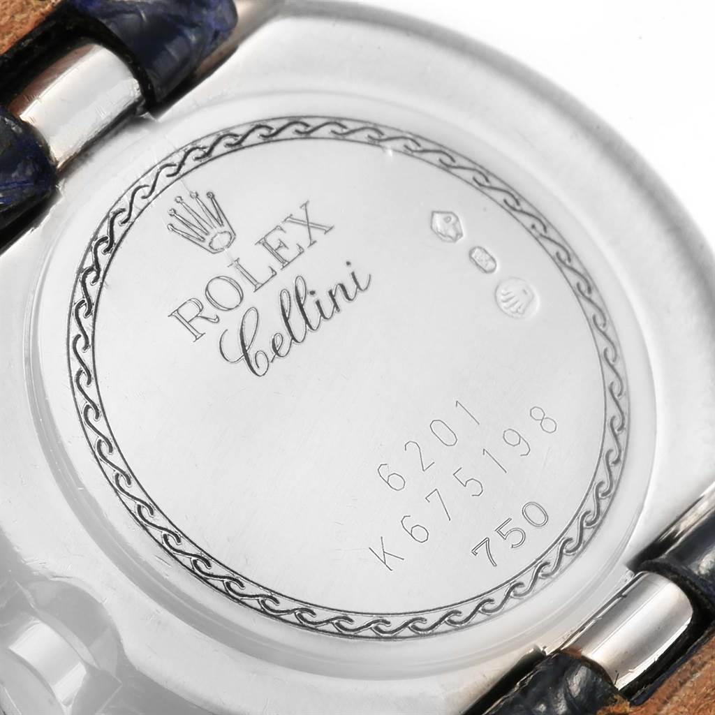 This is a close-up view of the back of a Rolex Cellini 6201 Women's White Gold Mother of Pearl Dial 6201 Women's White Gold Mother of Pearl Dial watch, showing its engraved details and serial numbers.