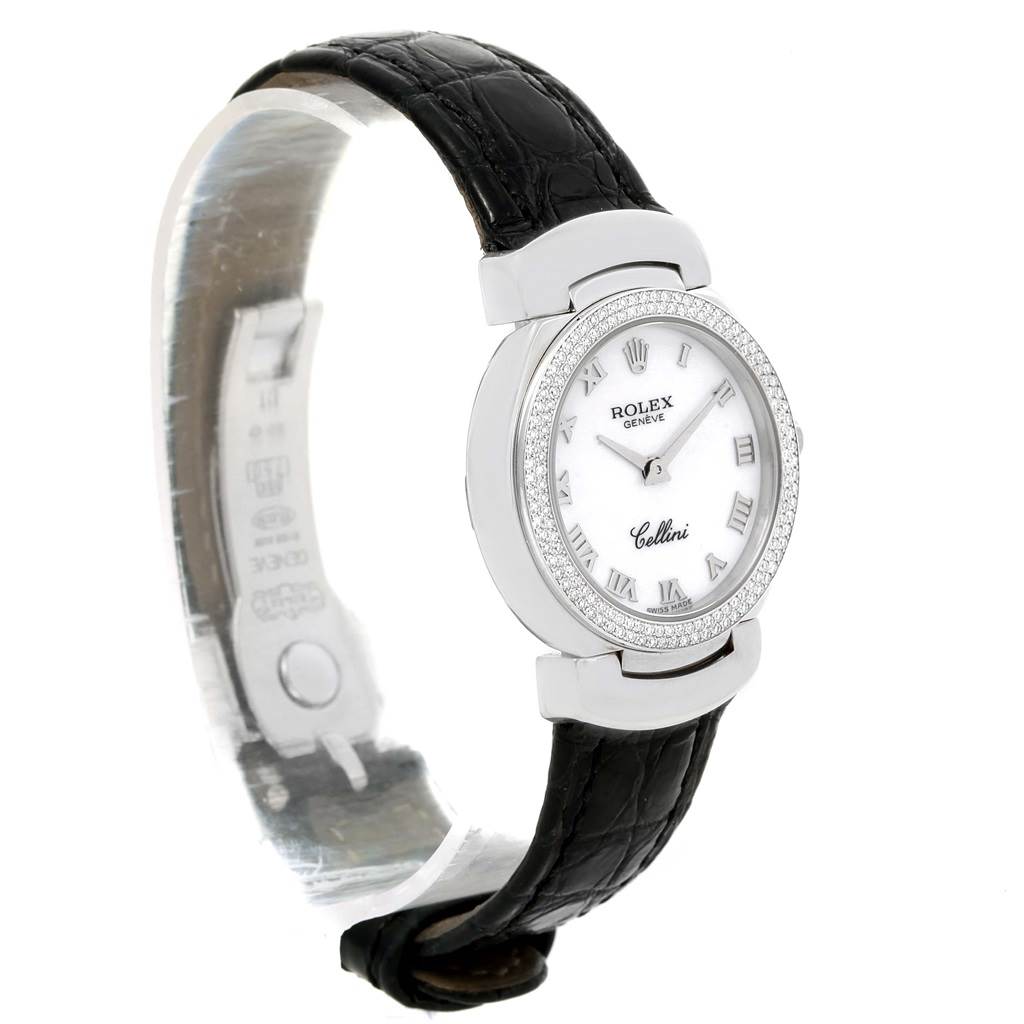 The Rolex Cellini 6671 Women's White Gold White Dial 6671 Women's White Gold White Dial watch is shown from a front-angle view, displaying its dial, bezel, and leather strap.