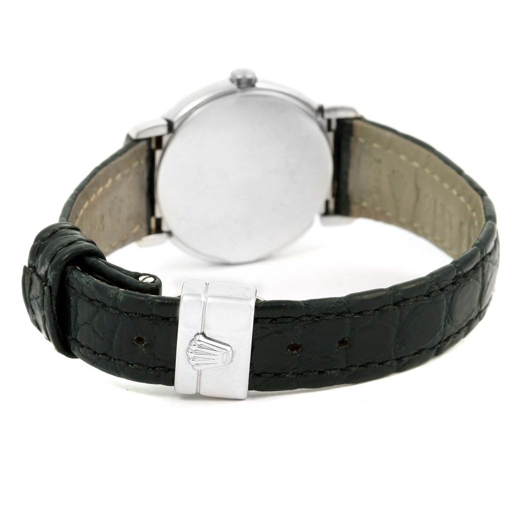 The image shows the back side and strap of a Rolex Cellini 6671 Women's White Gold White Dial 6671 Women's White Gold White Dial watch, highlighting the clasp with the logo.