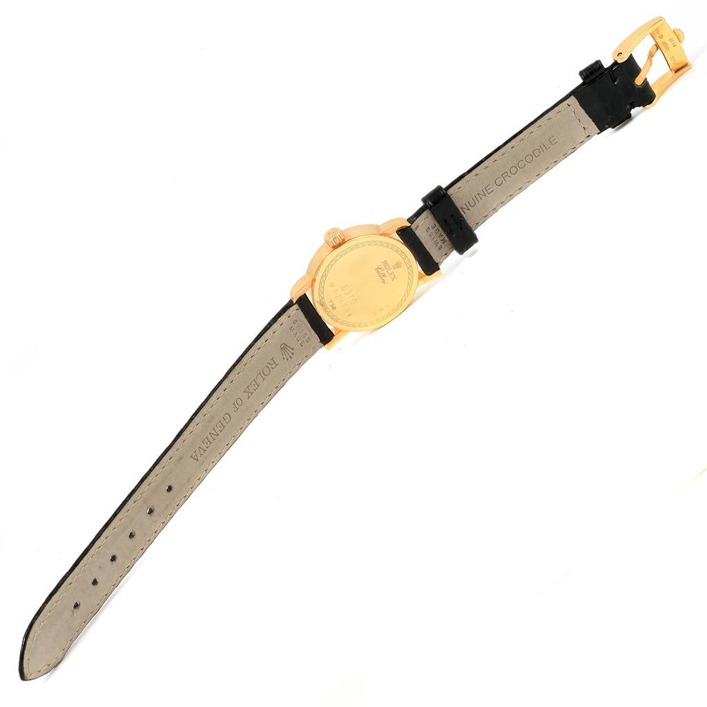 The image shows the back view of a Rolex Cellini 6110 Women's Yellow Gold Grey Dial 6110 Women's Yellow Gold Grey Dial watch, displaying the leather strap and gold clasp.