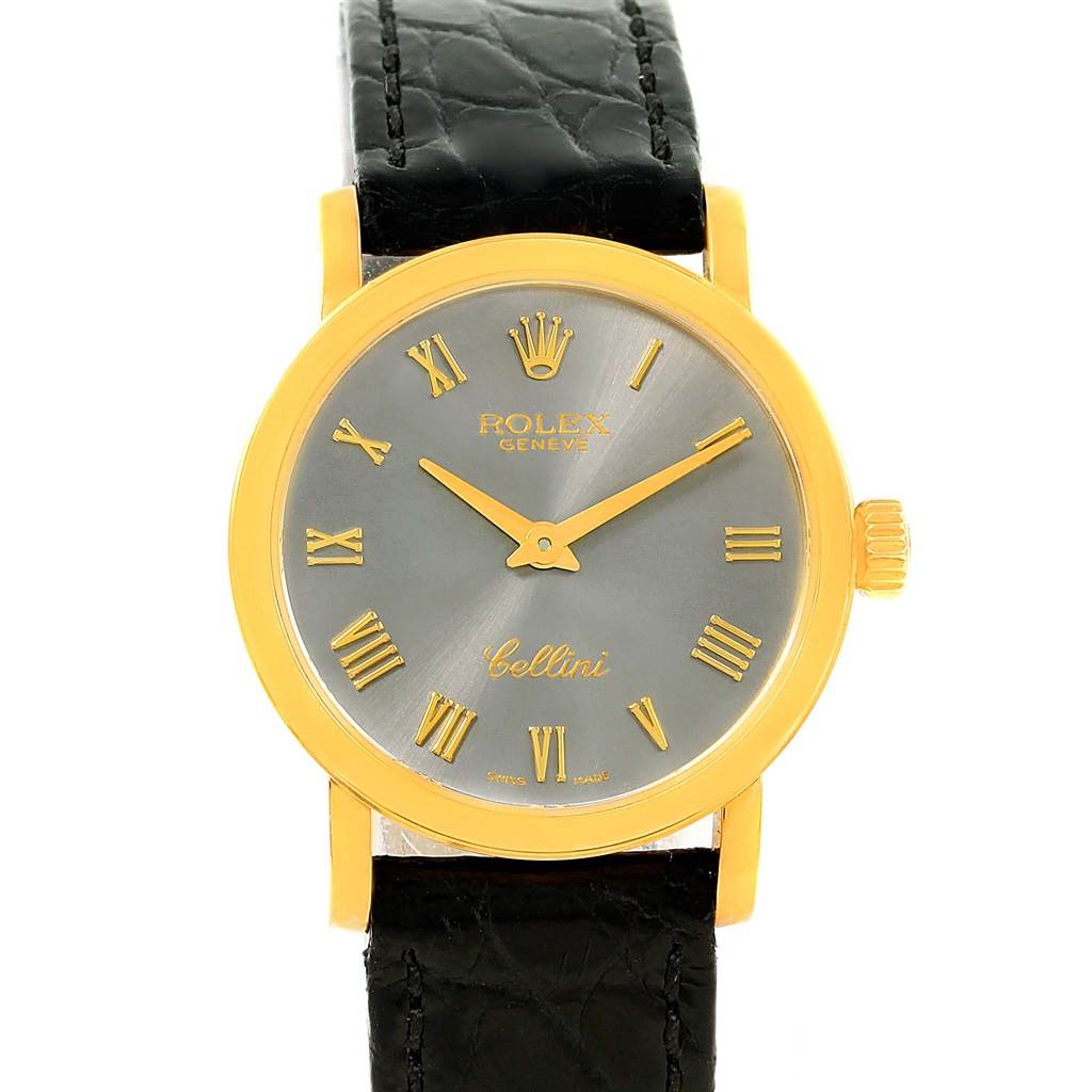 The image shows a frontal view of a Rolex Cellini 6110 Women's Yellow Gold Grey Dial 6110 Women's Yellow Gold Grey Dial watch, featuring a gold bezel, gray dial, and black leather strap.