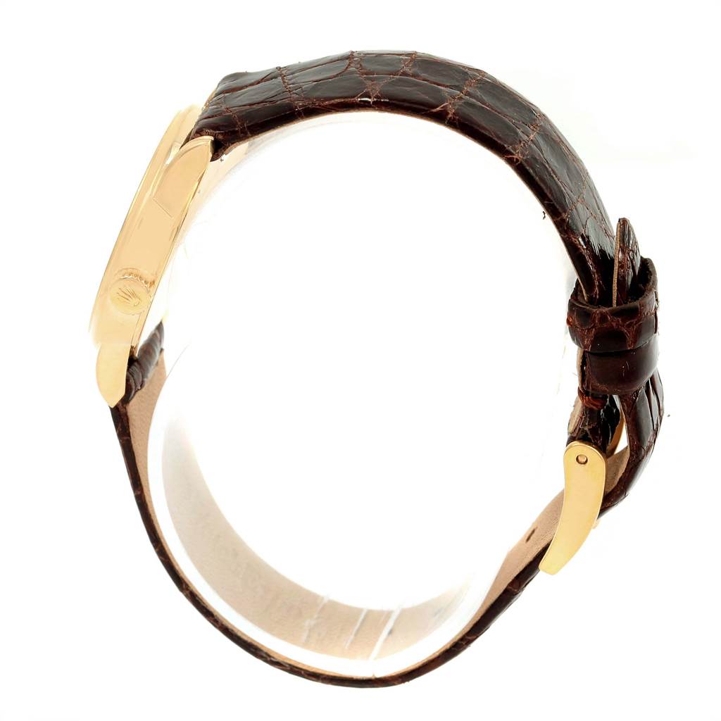 The image shows a side view of a Rolex Cellini 6111 Women's Yellow Gold Grey Dial 6111 Women's Yellow Gold Grey Dial watch, highlighting the brown leather strap and gold case.