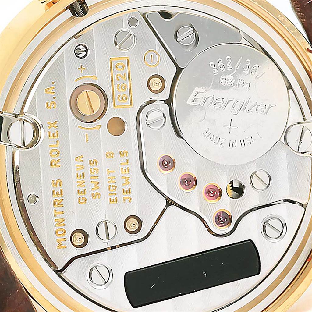 The image shows the internal mechanism and components of a Rolex Cellini 6111 Women's Yellow Gold Grey Dial 6111 Women's Yellow Gold Grey Dial watch, highlighting details such as the battery and jewels.