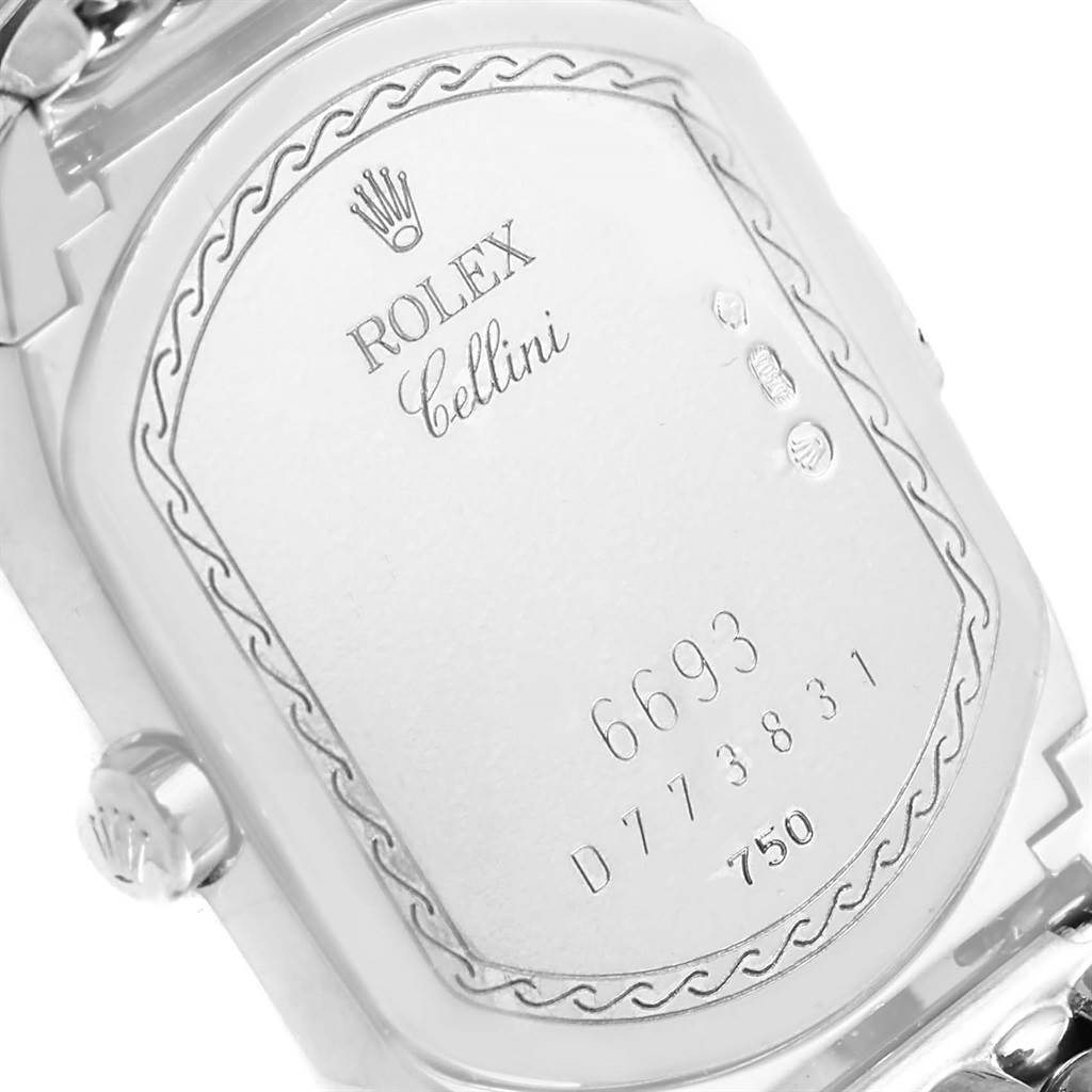 This image shows the back case of a Rolex Cellini 6693 Women
s White Gold Pink Dial 6693 Women
s White Gold Pink Dial watch, highlighting its engravings and crown logo.