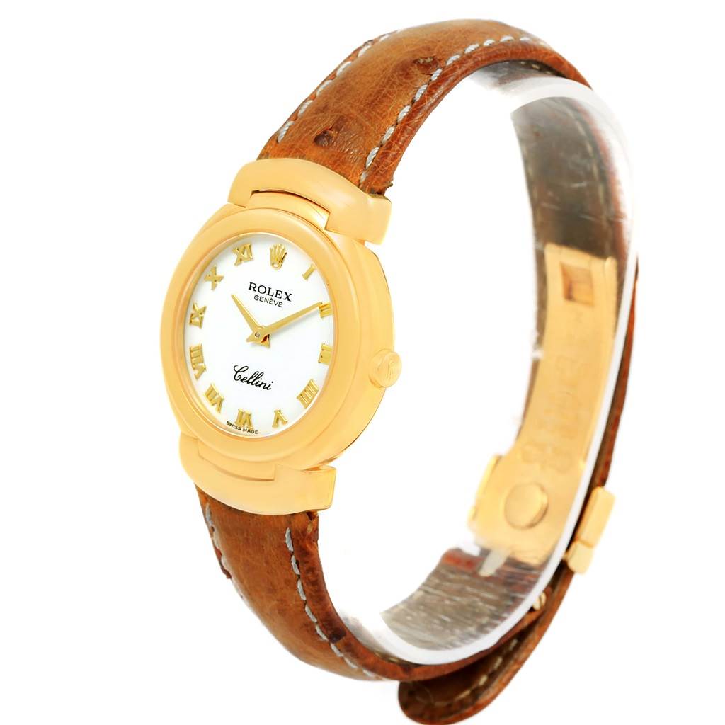 The Rolex Cellini 6621 Women's Yellow Gold White Dial 6621 Women's Yellow Gold White Dial watch is shown at a three-quarter angle, displaying its face, gold case, crown, and brown leather strap.