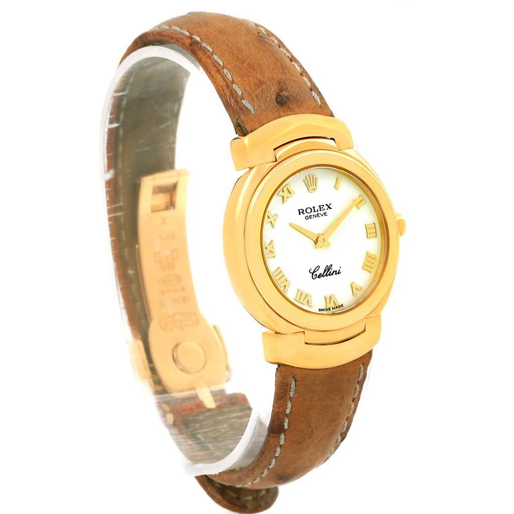 The Rolex Cellini 6621 Women's Yellow Gold White Dial 6621 Women's Yellow Gold White Dial watch is shown at a three-quarter angle, displaying its gold case, white dial with Roman numerals, and brown leather strap.