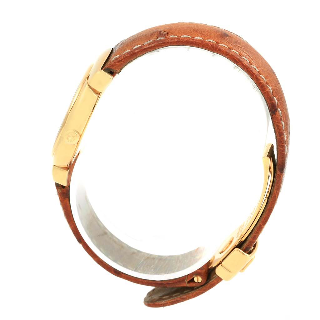 This image shows a Rolex Cellini 6621 Women's Yellow Gold White Dial 6621 Women's Yellow Gold White Dial watch from a side angle, highlighting its gold case and brown leather strap.