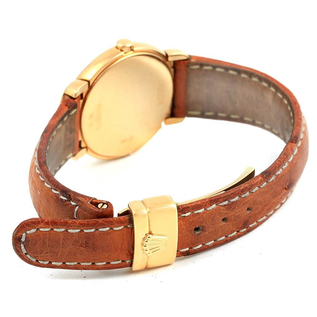 The image shows the back case and leather strap of a Rolex Cellini 6621 Women's Yellow Gold White Dial 6621 Women's Yellow Gold White Dial watch from an angled rear view.