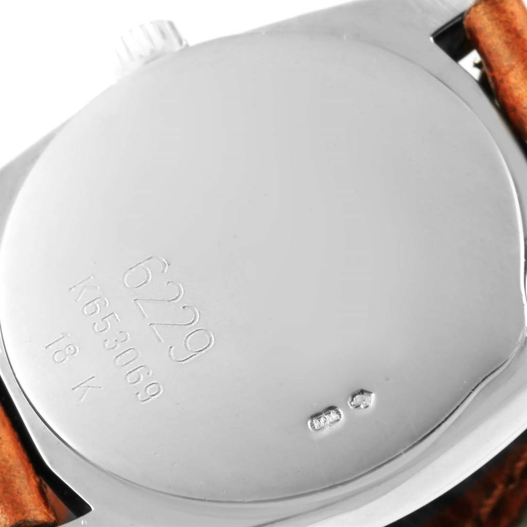 This image shows the back case of a Rolex Cellini 6229 Women's White Gold White Dial 6229 Women's White Gold White Dial watch, displaying its model number and 18K gold marking.