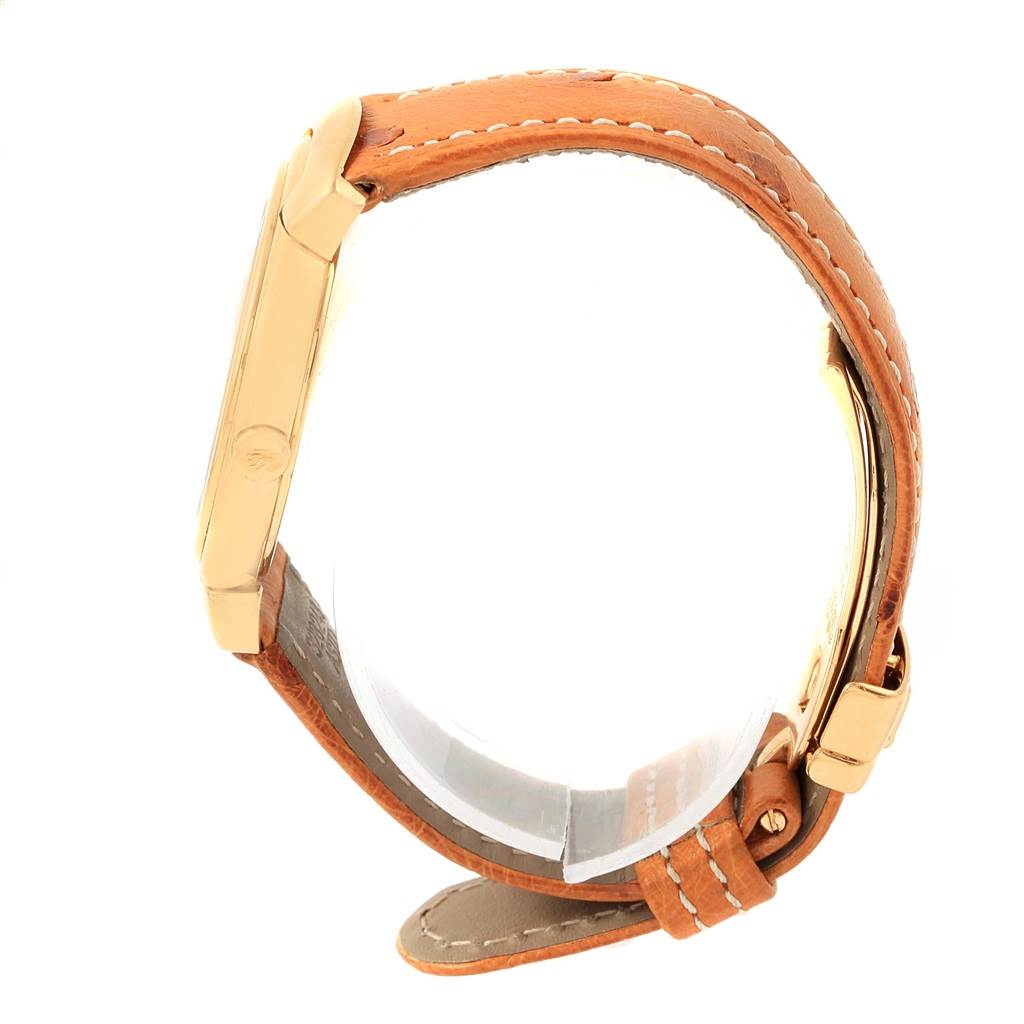 The image shows a side profile of a Rolex Cellini 6622 Women's Yellow Gold White Dial 6622 Women's Yellow Gold White Dial watch, highlighting its gold case and brown leather strap with stitching.