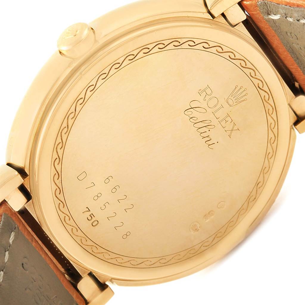This image shows the back of a Rolex Cellini 6622 Women's Yellow Gold White Dial 6622 Women's Yellow Gold White Dial watch, highlighting the case back, engraved details, and leather straps.