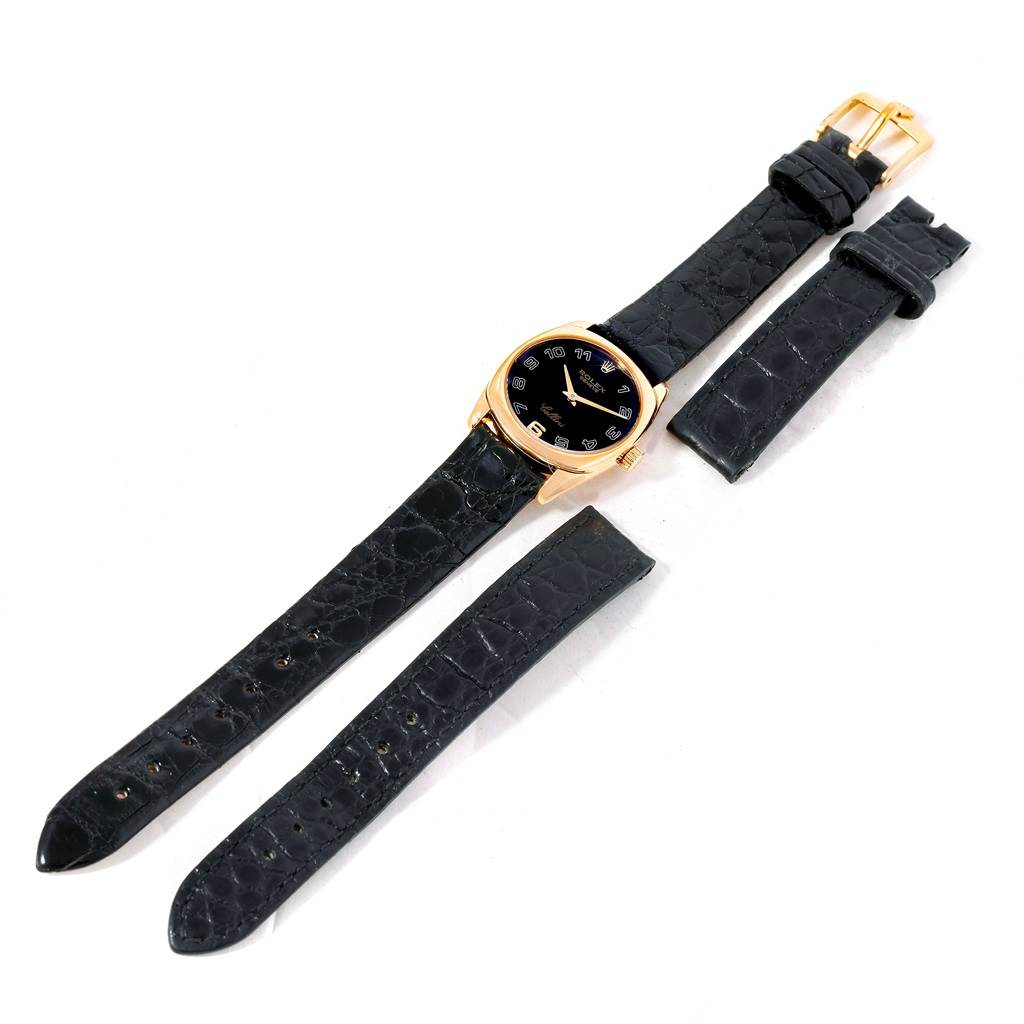 This image shows a Rolex Cellini 6229 Women
s Yellow Gold Black Dial 6229 Women
s Yellow Gold Black Dial watch with a golden case and black leather straps, including additional black leather strap parts.