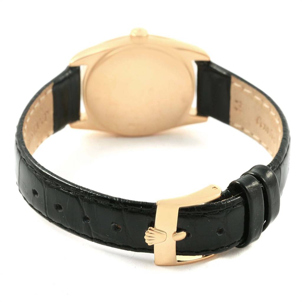 This image shows the back view and strap of the Rolex Cellini 6229 Women
s Yellow Gold White Dial 6229 Women
s Yellow Gold White Dial watch, including its black leather band and gold buckle.