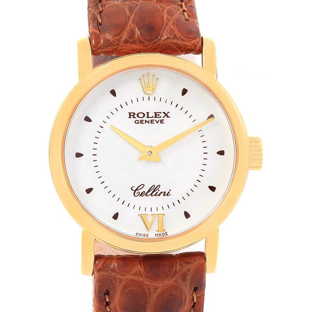 The Rolex Cellini 6610 Women's Yellow Gold Silver Dial 6610 Women's Yellow Gold Silver Dial watch is shown from the front, displaying the dial, hands, crown, and part of the leather strap.