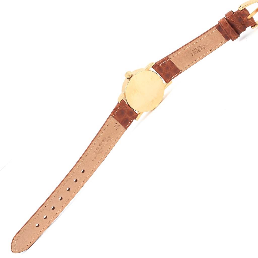 The image shows the back and side view of the Rolex Cellini 6610 Women's Yellow Gold Silver Dial 6610 Women's Yellow Gold Silver Dial watch, featuring its leather strap and gold case.