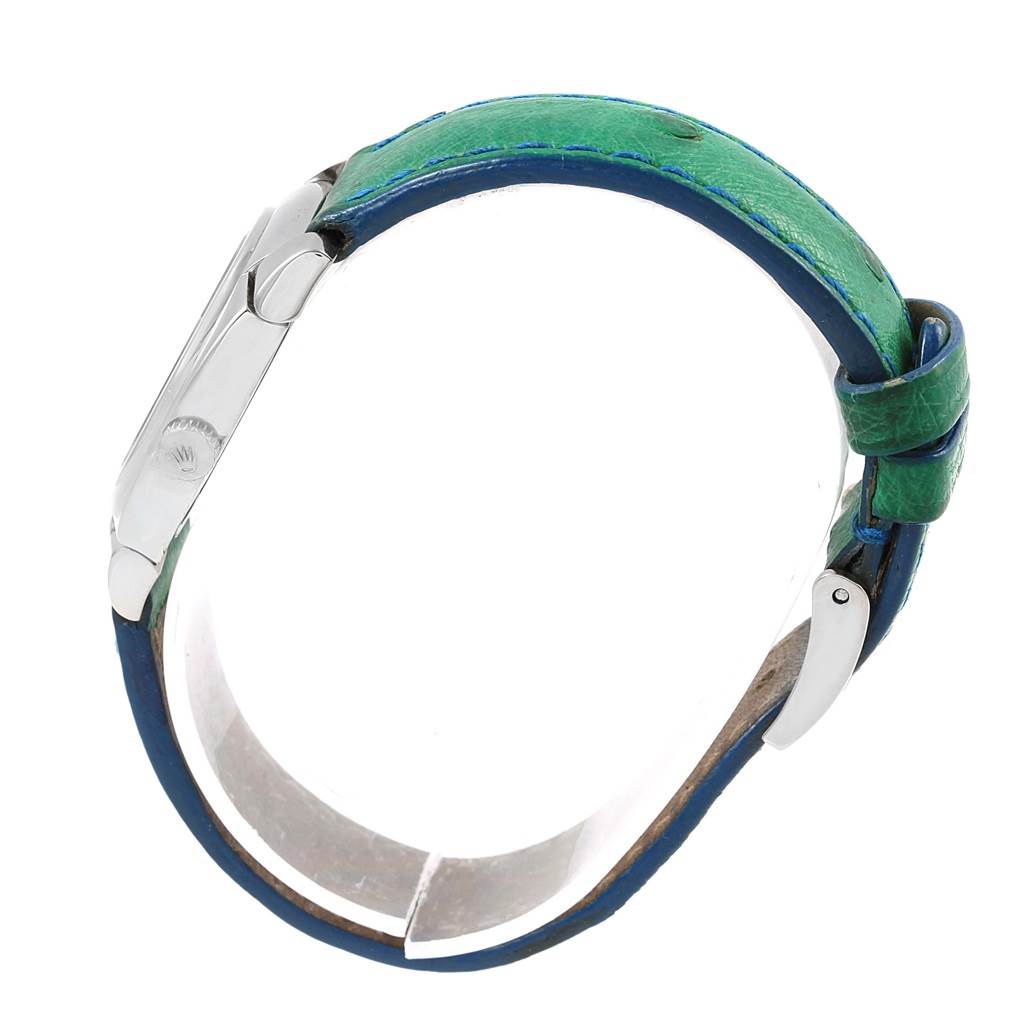 This image shows the side view of a Rolex Cellini 5310 Women's White Gold Mother of Pearl Dial 5310 Women's White Gold Mother of Pearl Dial watch, focusing on its green strap and buckle.