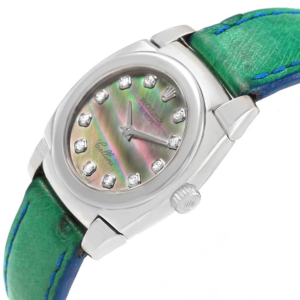 This image shows a Rolex Cellini 5310 Women's White Gold Mother of Pearl Dial 5310 Women's White Gold Mother of Pearl Dial watch with a green leather strap, focusing on the face, bezel, and crown at an oblique angle.