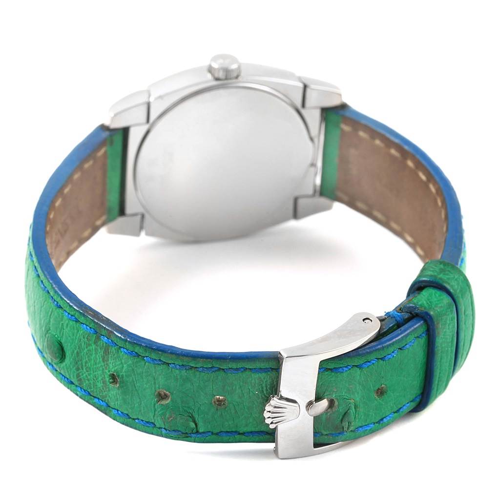 This image shows the back of the Rolex Cellini 5310 Women's White Gold Mother of Pearl Dial 5310 Women's White Gold Mother of Pearl Dial watch, featuring the case back, crown, and green leather strap with a clasp.