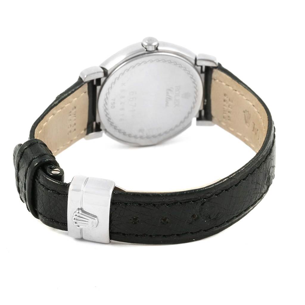 The image shows the back view of a Rolex Cellini 6671 Women
s White Gold Silver Dial 6671 Women
s White Gold Silver Dial watch, focusing on the leather strap and clasp.