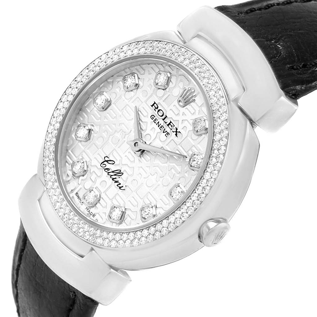 The image shows a close-up of the Rolex Cellini 6671 Women
s White Gold Silver Dial 6671 Women
s White Gold Silver Dial watch
s face and partial leather strap, viewed from an angle revealing the bezel and side.