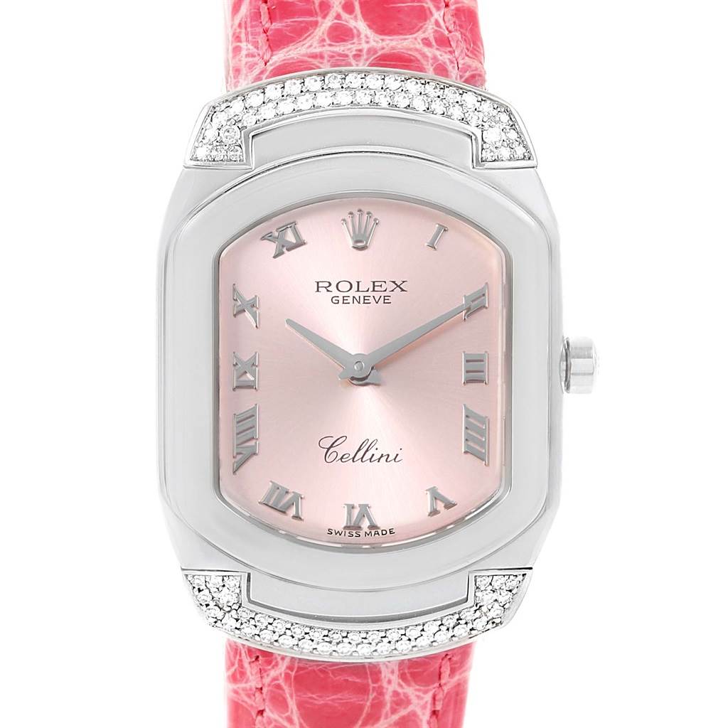 The image shows a front view of a Rolex Cellini 6692 Women
s White Gold Pink Dial 6692 Women
s White Gold Pink Dial watch with a pink dial and a red strap.