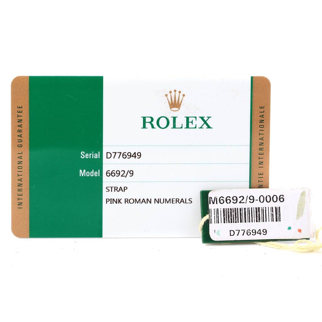 This image shows a warranty card for the Rolex Cellini 6692 Women
s White Gold Pink Dial 6692 Women
s White Gold Pink Dial model 6692/9, displaying the serial number D776949 and details about the strap.