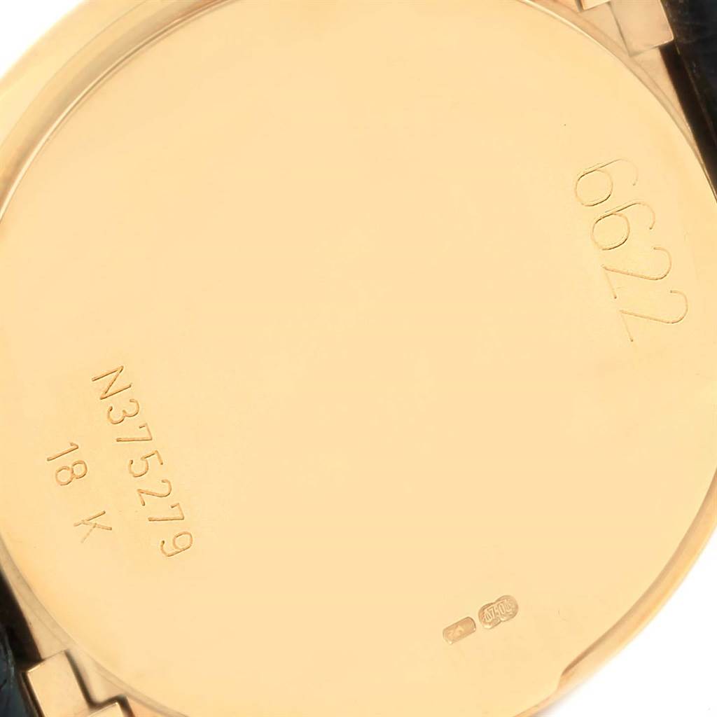 This image shows the back case of a Rolex Cellini 6622 Women's Yellow Gold White Dial 6622 Women's Yellow Gold White Dial watch, highlighting its 18K gold hallmark and serial number engraving.