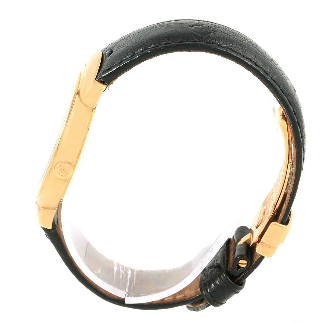 The image shows a side view of a Rolex Cellini 6622 Women's Yellow Gold White Dial 6622 Women's Yellow Gold White Dial watch, highlighting its gold case and black leather strap.