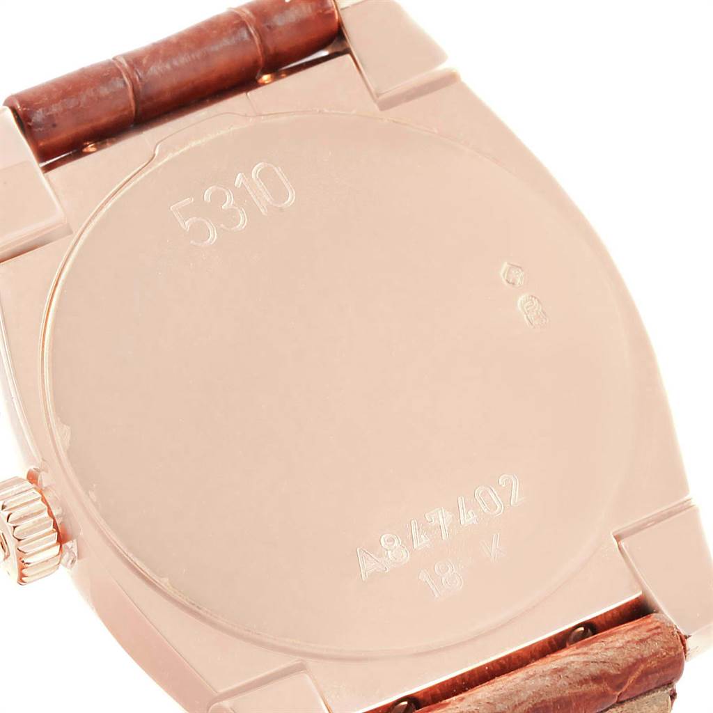 The image shows the back casing and a portion of the leather strap of a Rolex Cellini 5310 Women's Rose Gold White Dial 5310 Women's Rose Gold White Dial watch.