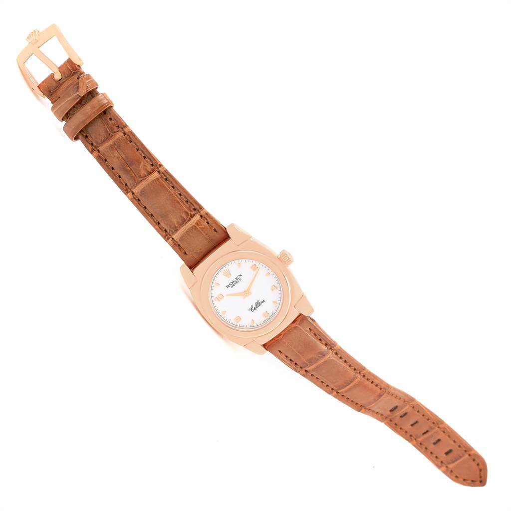 The image shows the Rolex Cellini 5310 Women's Rose Gold White Dial 5310 Women's Rose Gold White Dial watch from an angled top-down view, highlighting the watch face, case, crown, and leather strap.