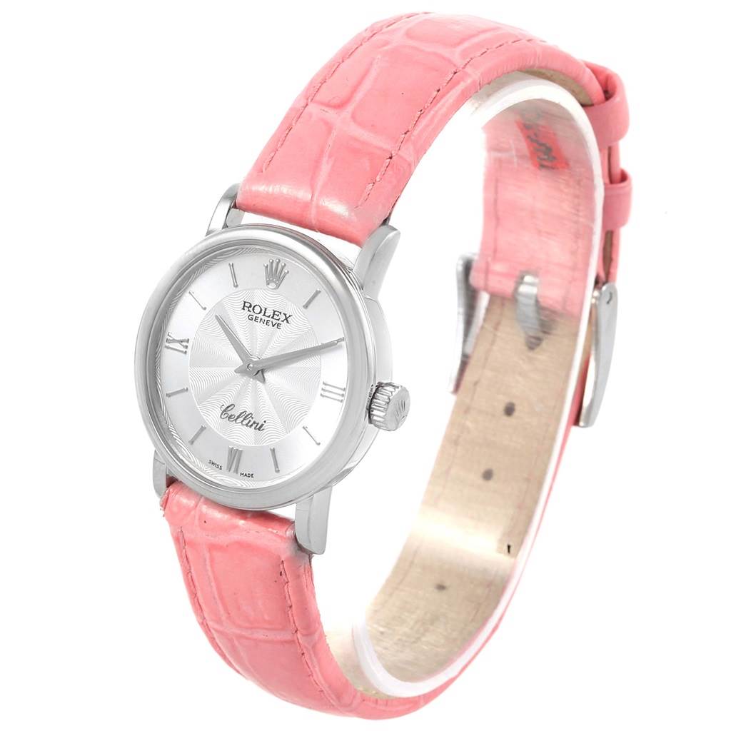This image shows the front and partial side view of a Rolex Cellini 6110 Women
s White Gold Silver Dial 6110 Women
s White Gold Silver Dial watch with a pink leather strap.