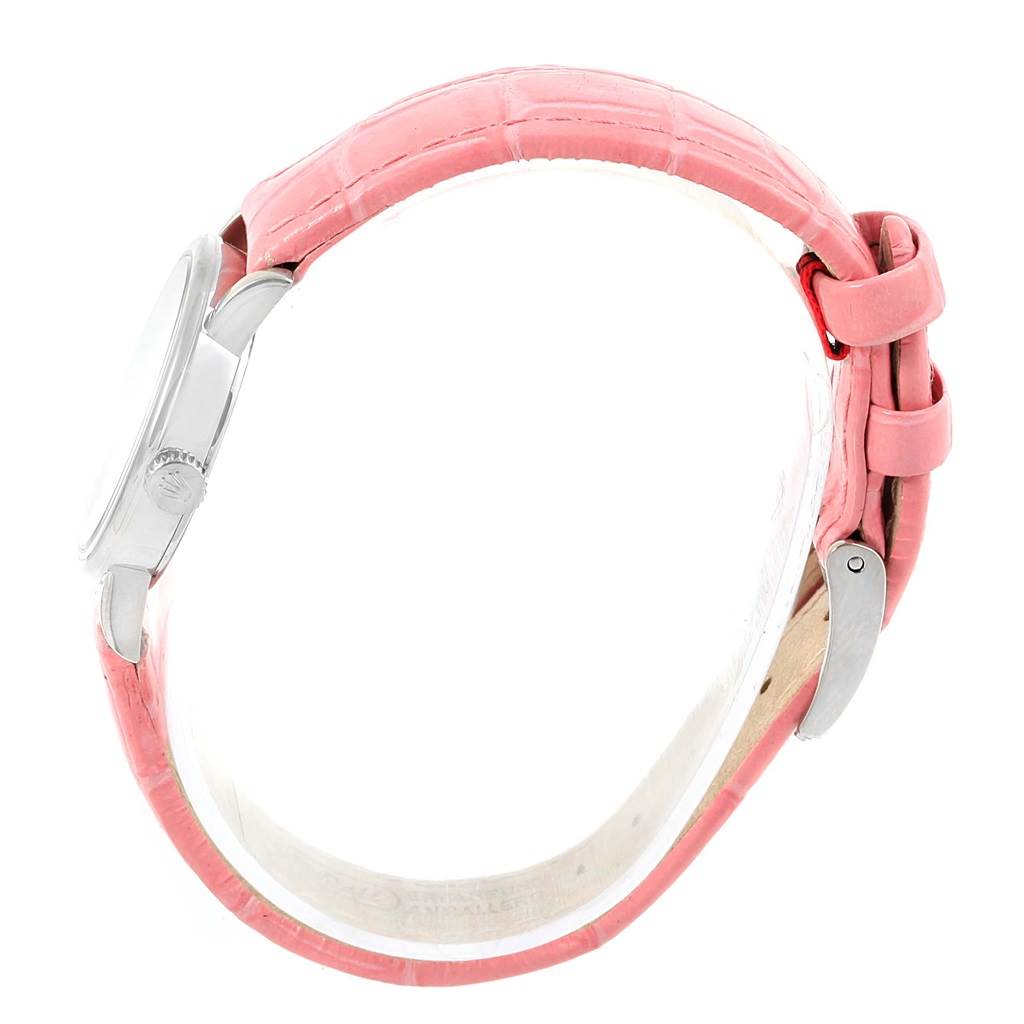 The Rolex Cellini 6110 Women
s White Gold Silver Dial 6110 Women
s White Gold Silver Dial watch is shown from the side, highlighting the pink strap and crown.