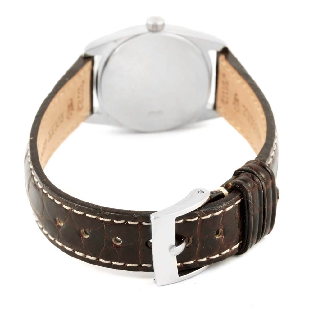 This image shows the back of the Cellini model by Rolex, highlighting the leather strap and buckle.