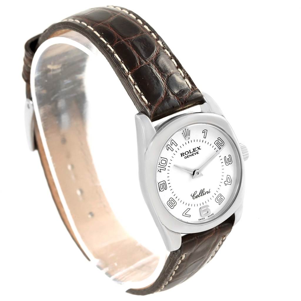 This image shows a Rolex Cellini 6229 Women's White Gold White Dial 6229 Women's White Gold White Dial watch featuring a white dial, silver case, and brown leather strap at a three-quarter angle.