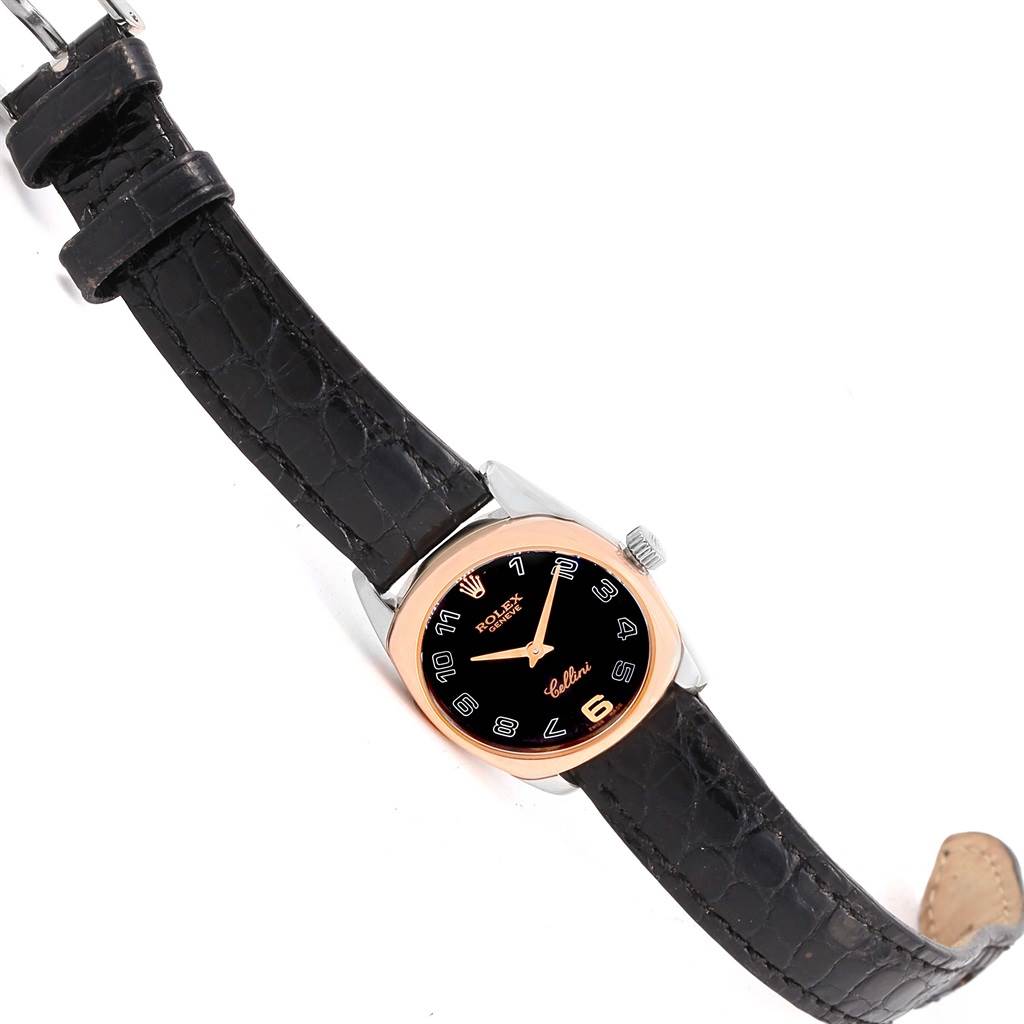 The Rolex Cellini 6229 Women
s White Gold Black Dial 6229 Women
s White Gold Black Dial watch is shown at an angle displaying the face, bezel, and leather strap.