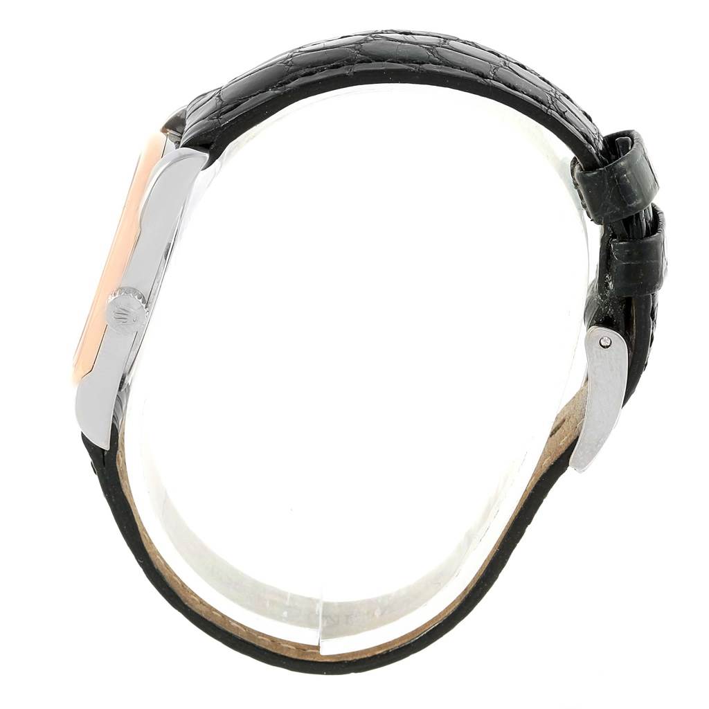 This image shows the side profile of a Rolex Cellini 6229 Women
s White Gold Black Dial 6229 Women
s White Gold Black Dial watch, highlighting the crown, bezel, and leather strap.