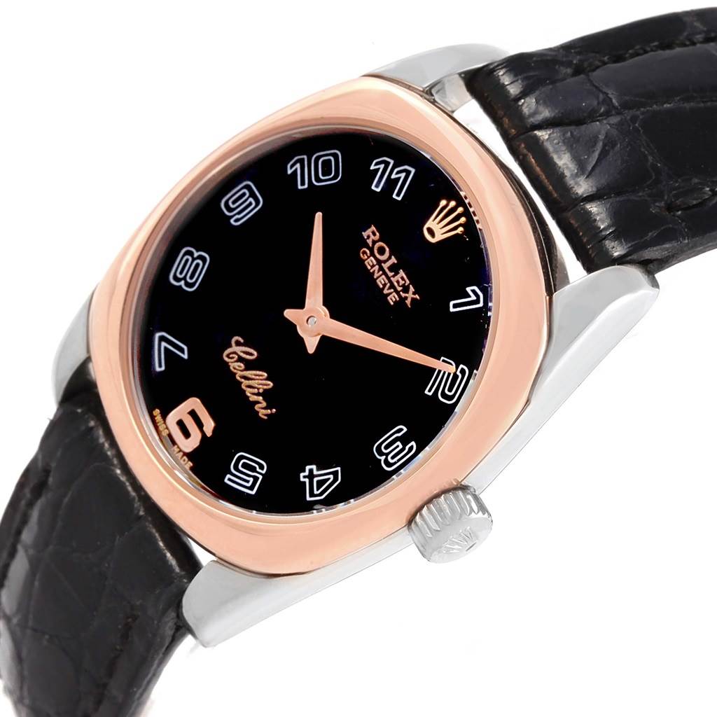 This Rolex Cellini 6229 Women
s White Gold Black Dial 6229 Women
s White Gold Black Dial watch is shown at an angle displaying the face, crown, and part of the leather strap.