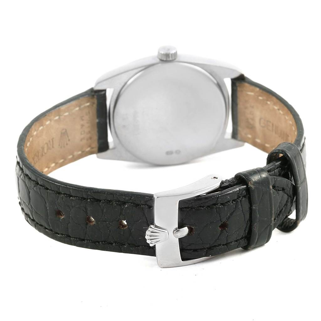 The image shows the back view of a Rolex Cellini 6229 Women
s White Gold Black Dial 6229 Women
s White Gold Black Dial watch, featuring its leather strap and buckle.