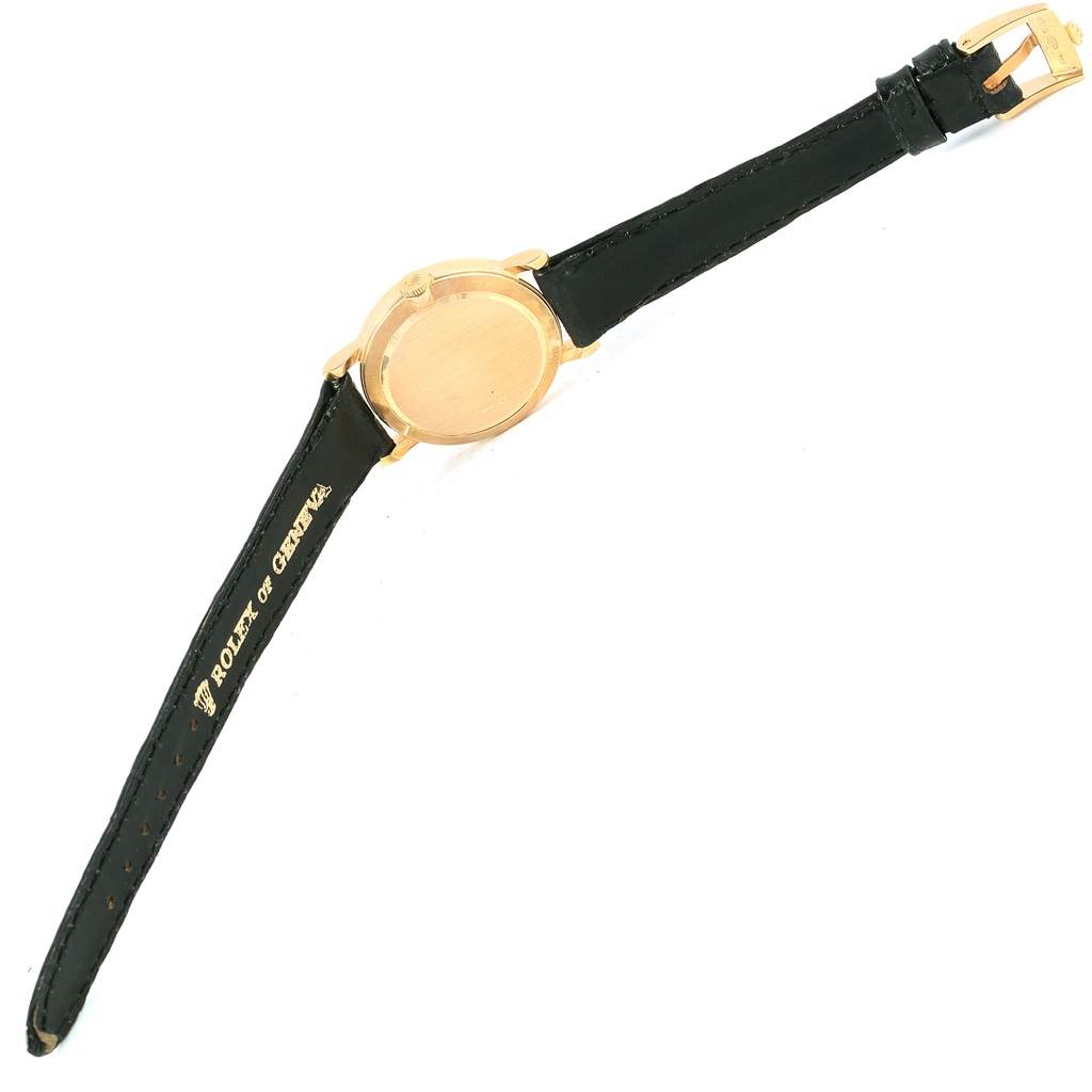 This image shows a Rolex Cellini 5109 Women's Yellow Gold Mother of Pearl Dial 5109 Women's Yellow Gold Mother of Pearl Dial model watch from the back with a leather strap and a gold-tone buckle.