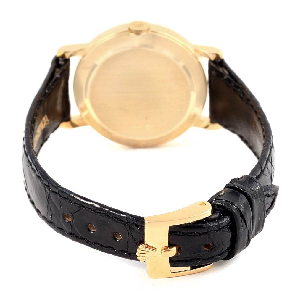 The image shows the back case and strap of a Rolex Cellini 5109 Women's Yellow Gold Mother of Pearl Dial 5109 Women's Yellow Gold Mother of Pearl Dial watch, highlighting its gold case and black leather band.