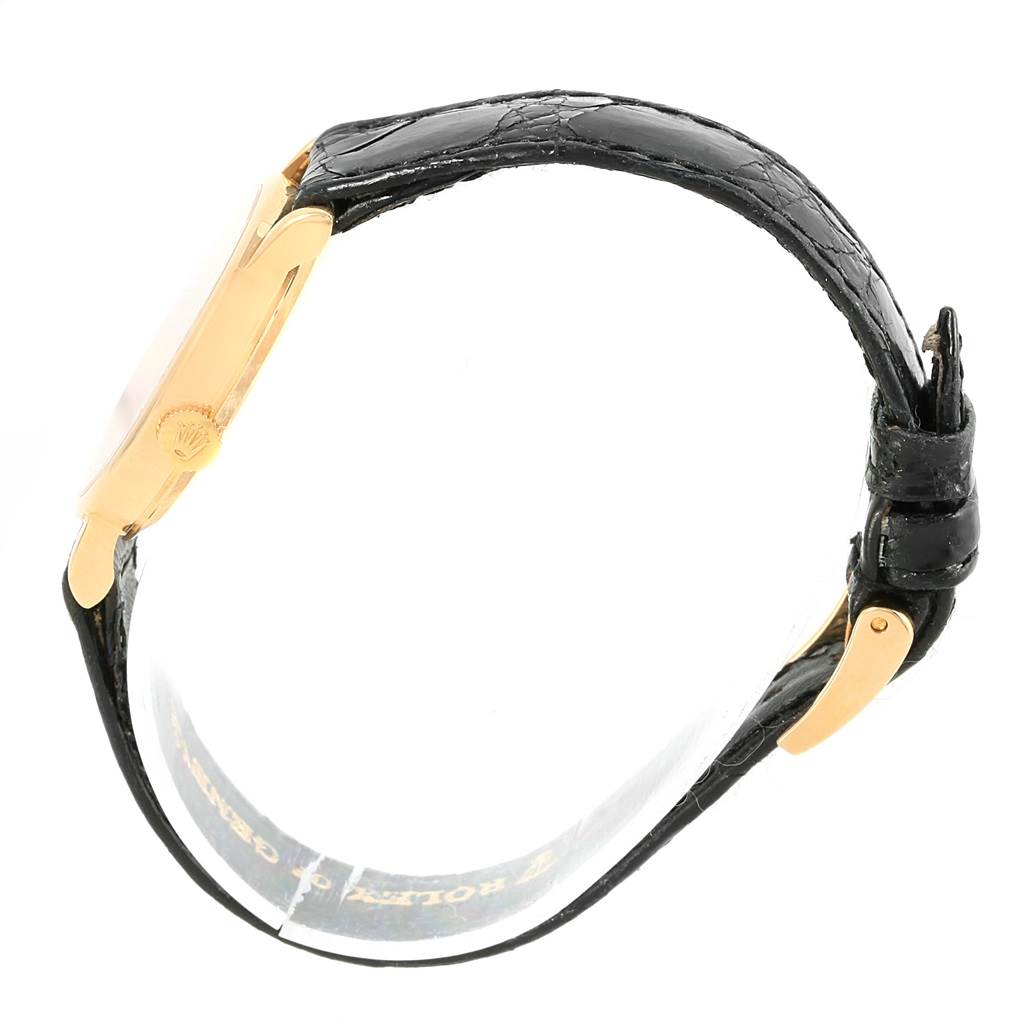 The image shows a Rolex Cellini 5109 Women's Yellow Gold Mother of Pearl Dial 5109 Women's Yellow Gold Mother of Pearl Dial watch from a side angle, highlighting the black leather strap and gold case.